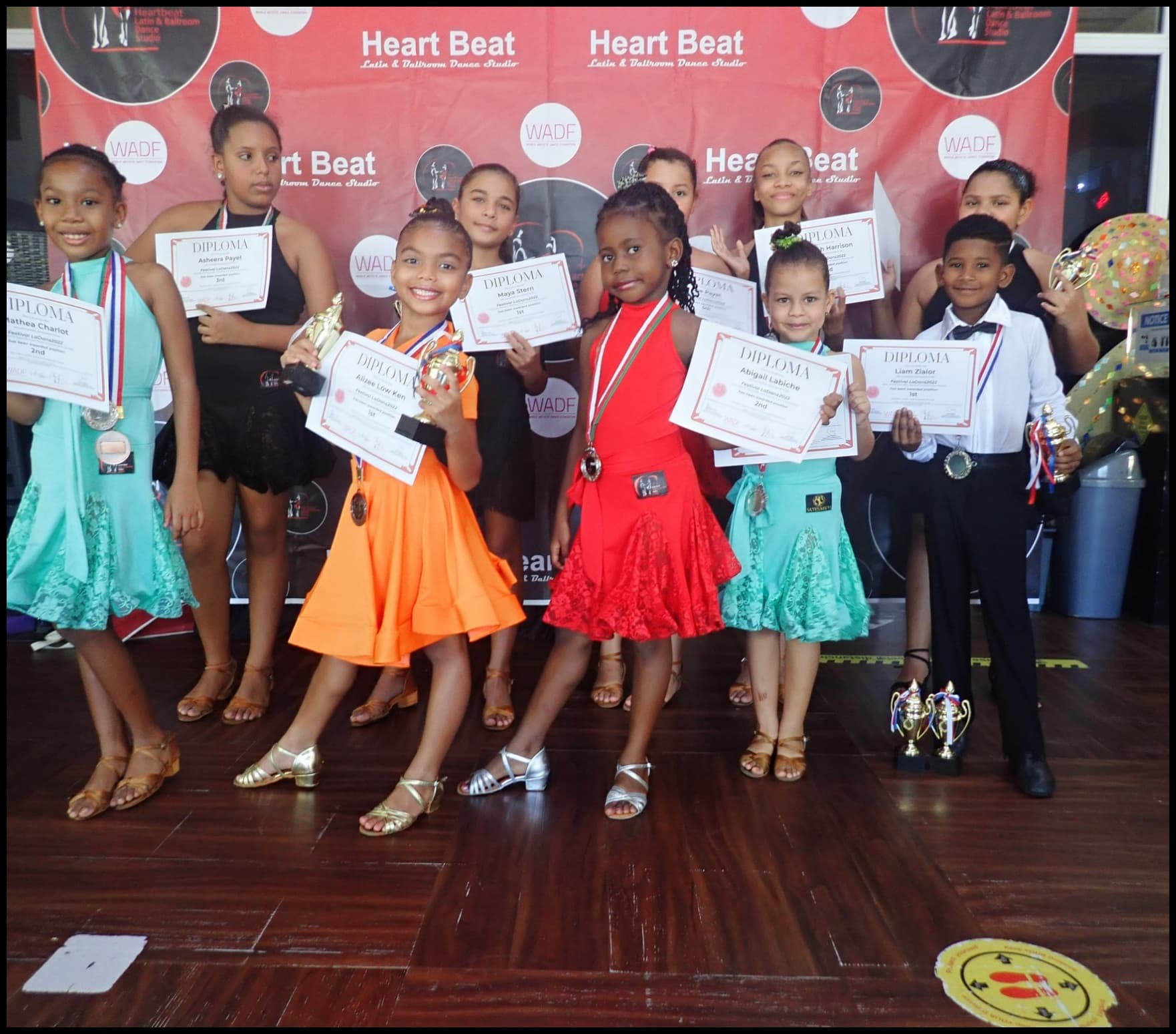 Heartbeat students with their competition diplomas and trophies